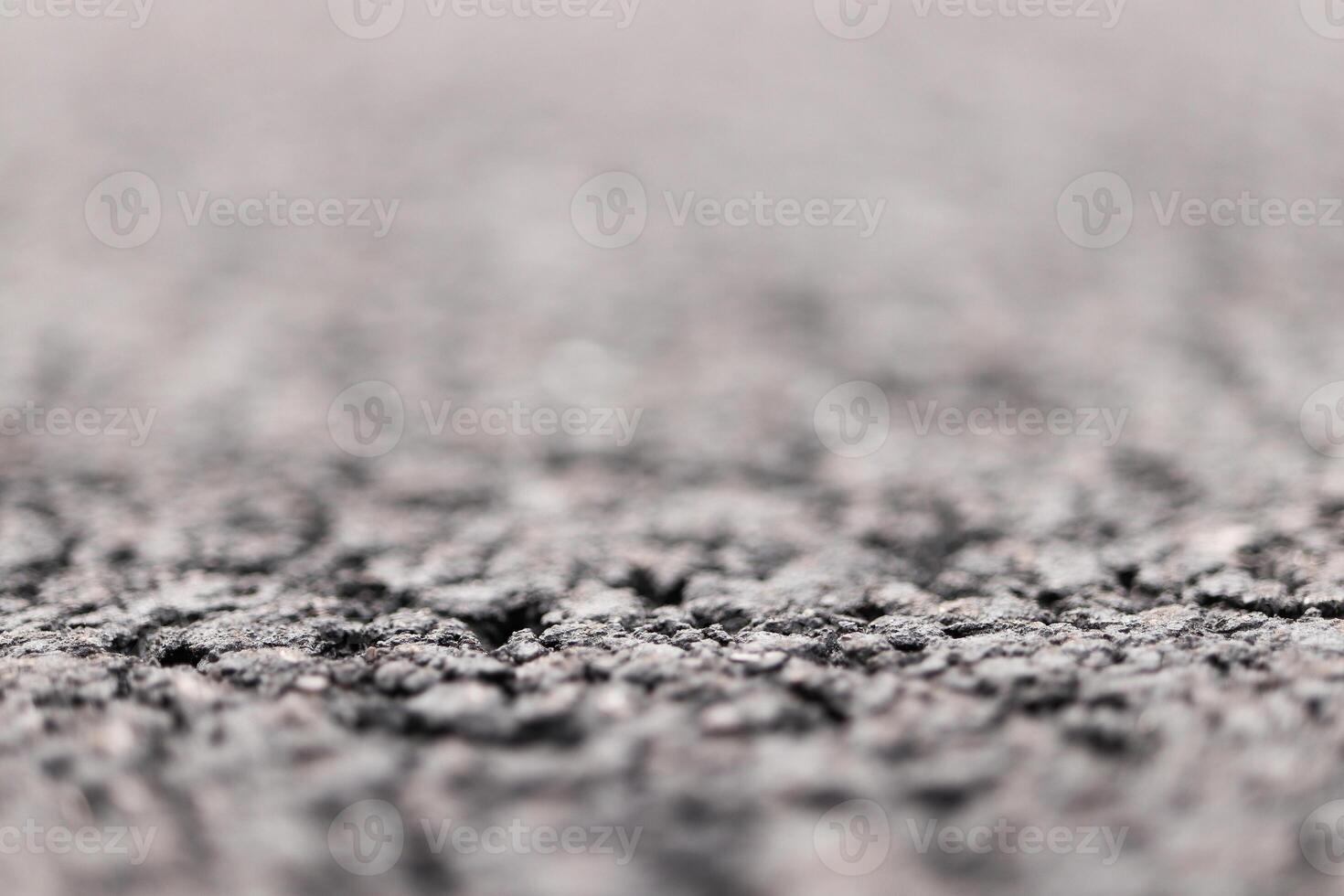 Asphalt Road focused foreground with blurred background. photo