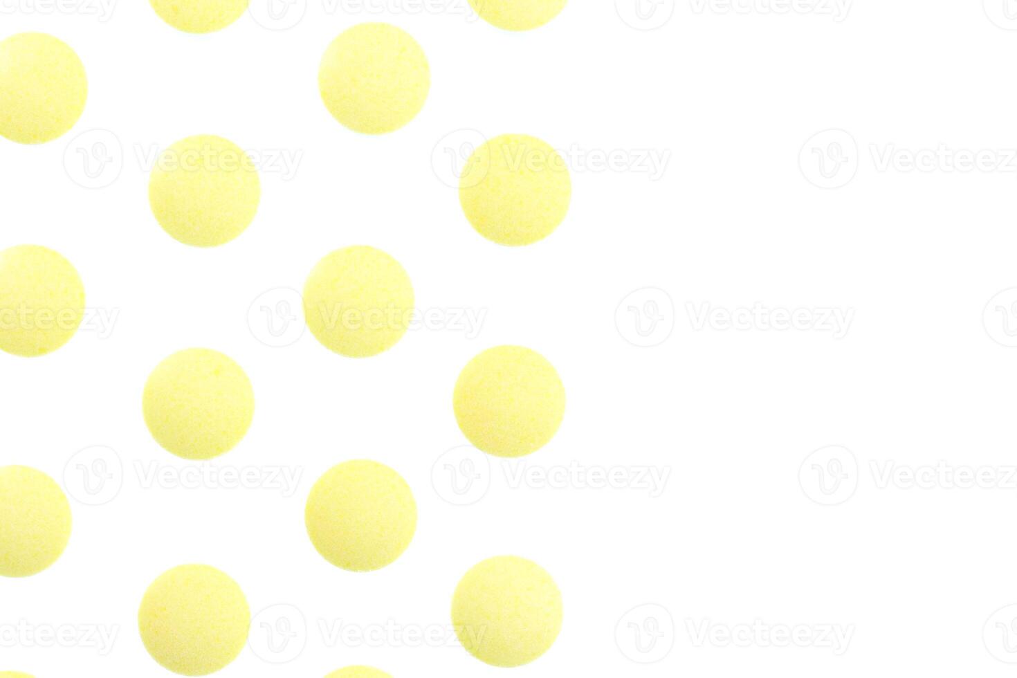 Yellow Isolated Pills Pattern Texture. Medical Tablets Background. Macro Closeup. photo