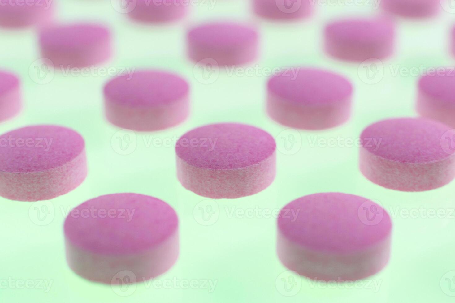 Pink Isolated Pills Texture. Medical Tablets Background. Macro Closeup. photo