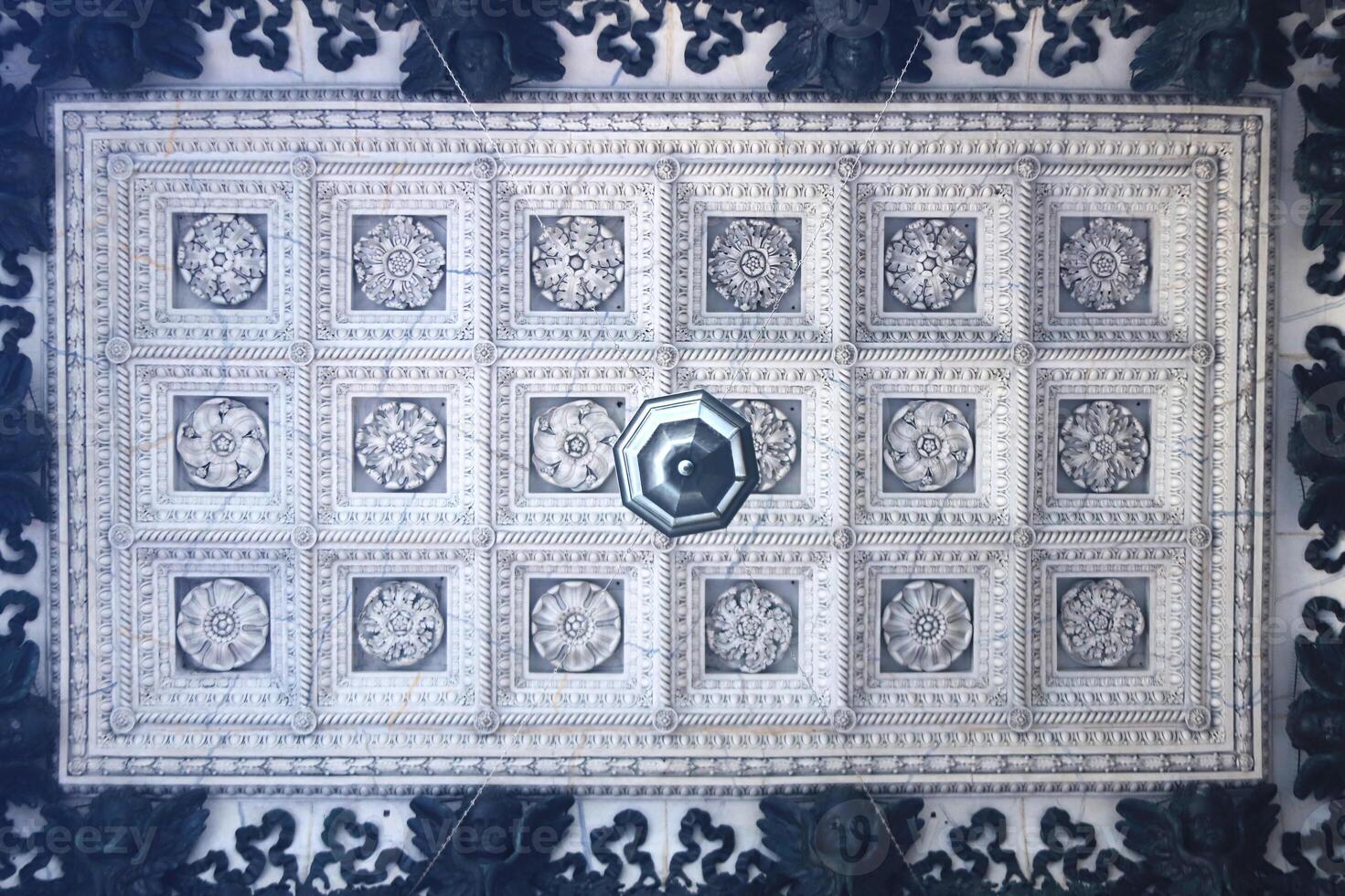The ceiling of the hall of St. Isaac's Cathedral is decorated with 18 different flower ornaments and framed by small black angels along the perimeter. Saint-Petersburg photo