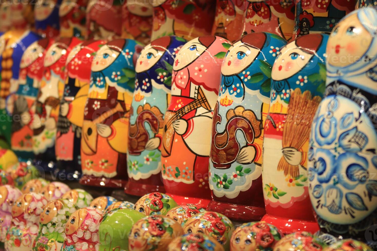 A lot of souvenirs of nesting dolls. Many colored nesting dolls. photo