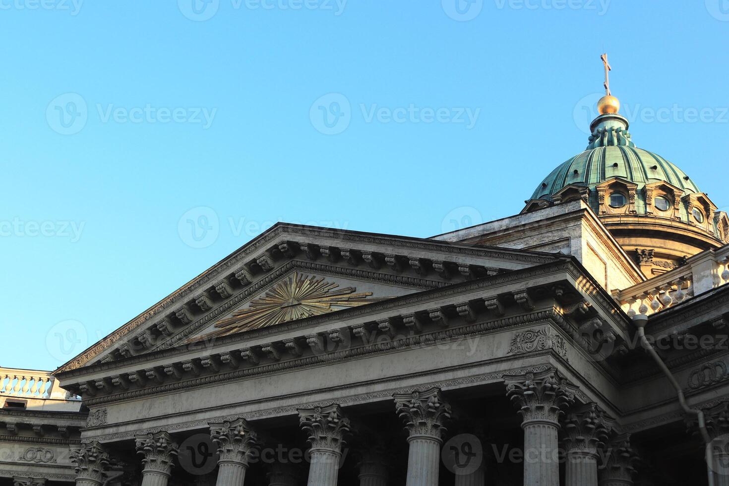 Facade of Kazan Cathedral. Saint-Petersburg. In the center is a silhouette of a shining pyramid. photo