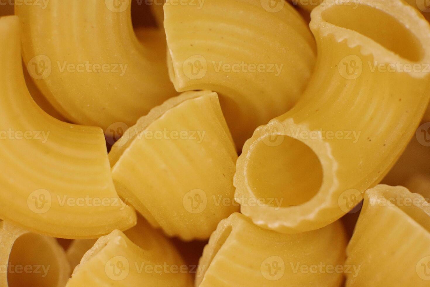 Many Horns Pasta Texture. Traditional Noodles. Uncooked Macaroni Food Background. Macro Closeup. photo