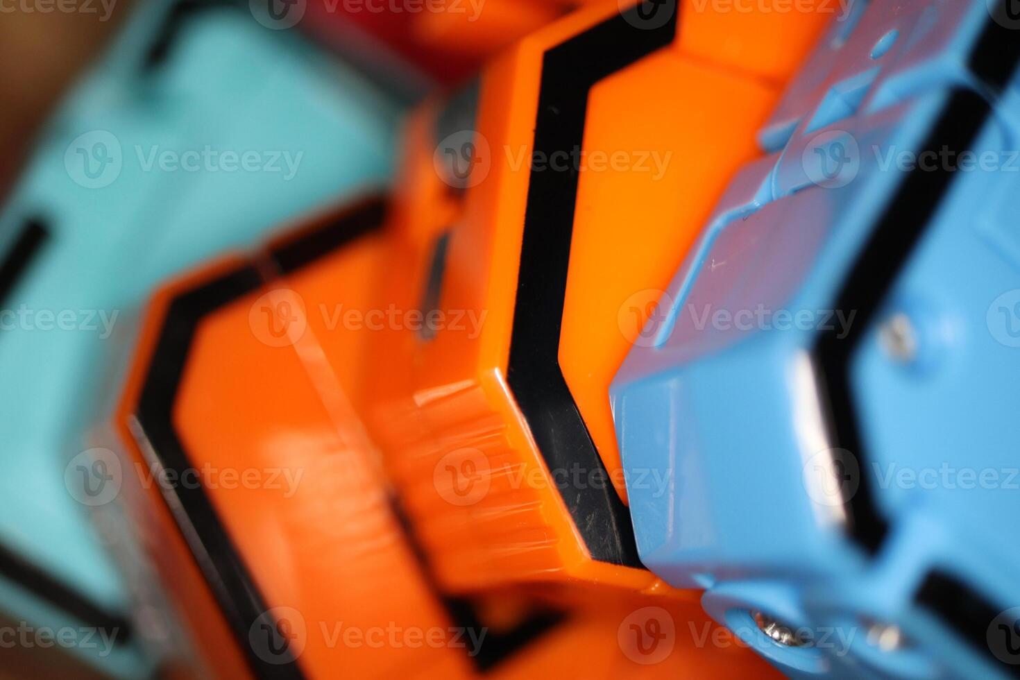Many Colored Transformer Toys. Assembled Plastic Construction Background. Macro Closeup. photo