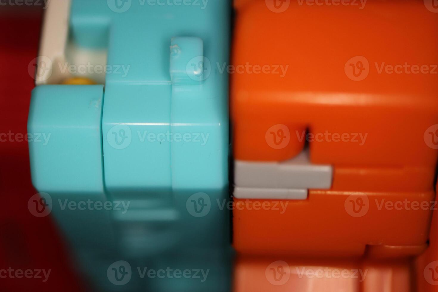 Modern Colored Transformer Toys. Assembled Plastic Construction Background. Macro Closeup. photo