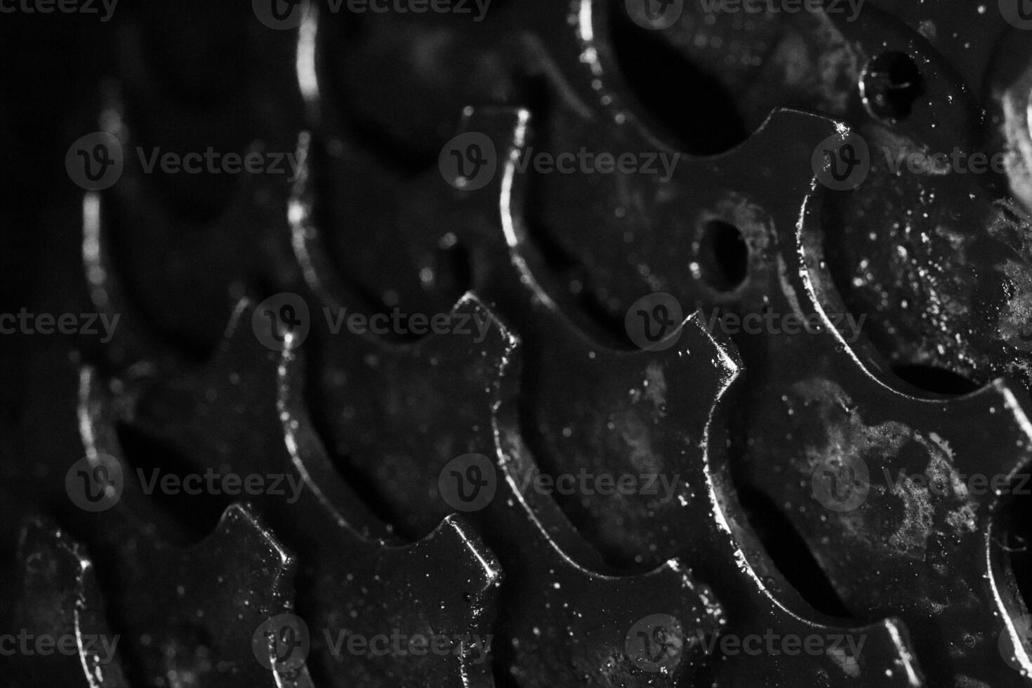 Black Dirty Bicycle Gears Texture. Macro Monochrome Closeup Background. photo