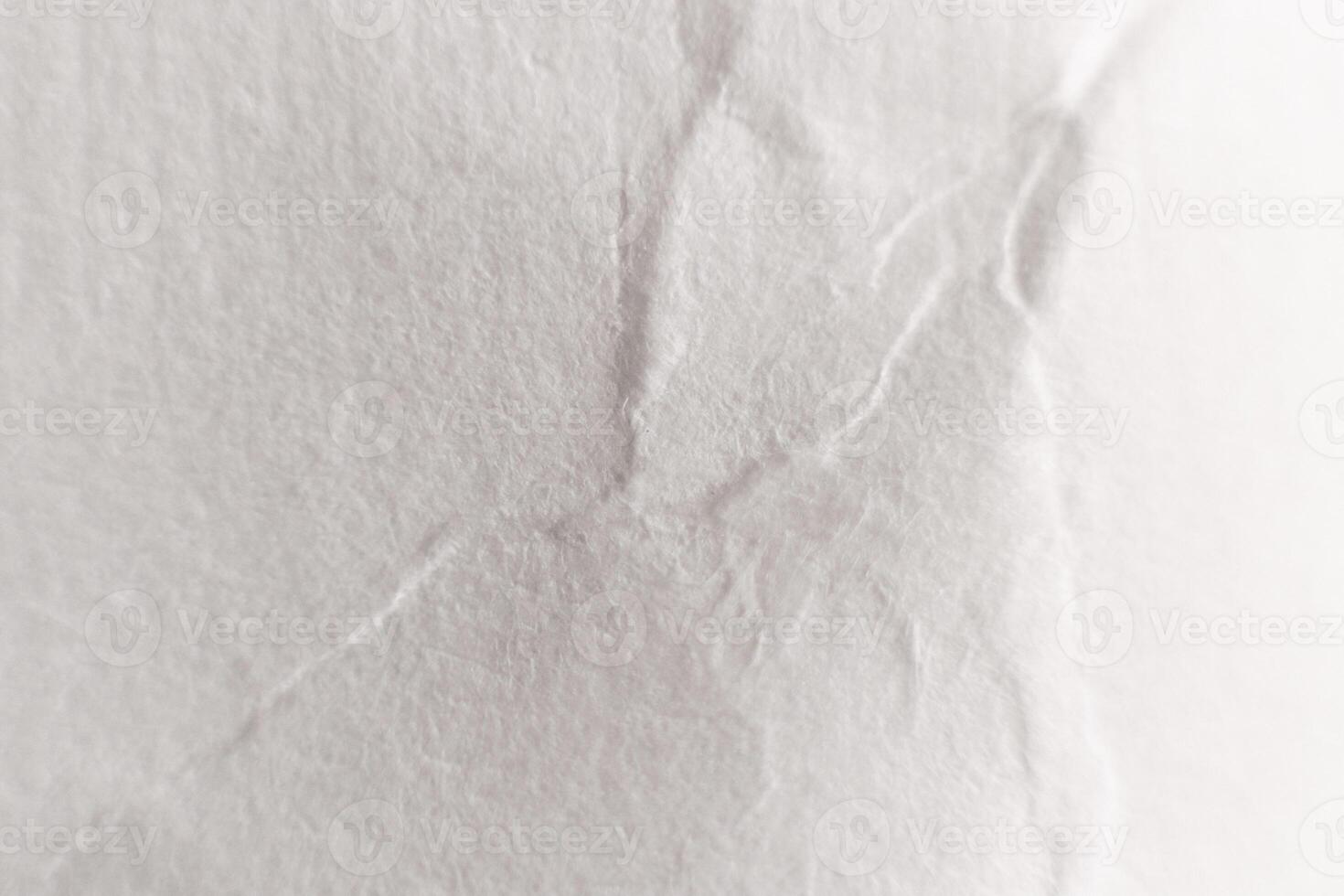 Crumpled White Paper Texture with Soft Folds. Macro Closeup. photo