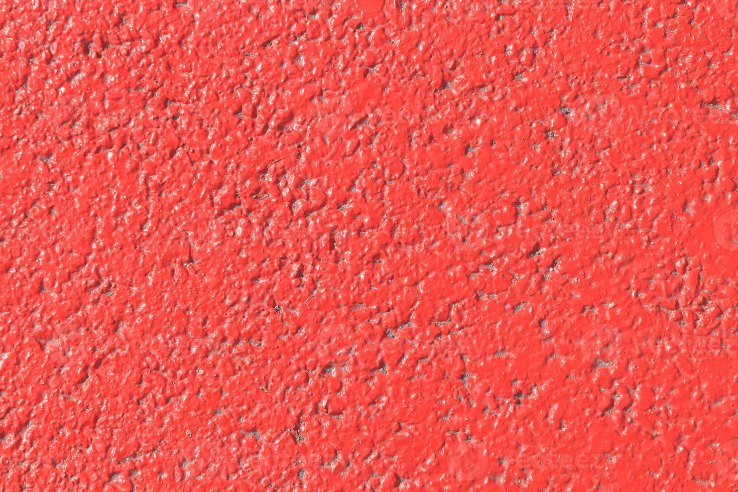 Red painted asphalt texture. Colored road surface background. photo