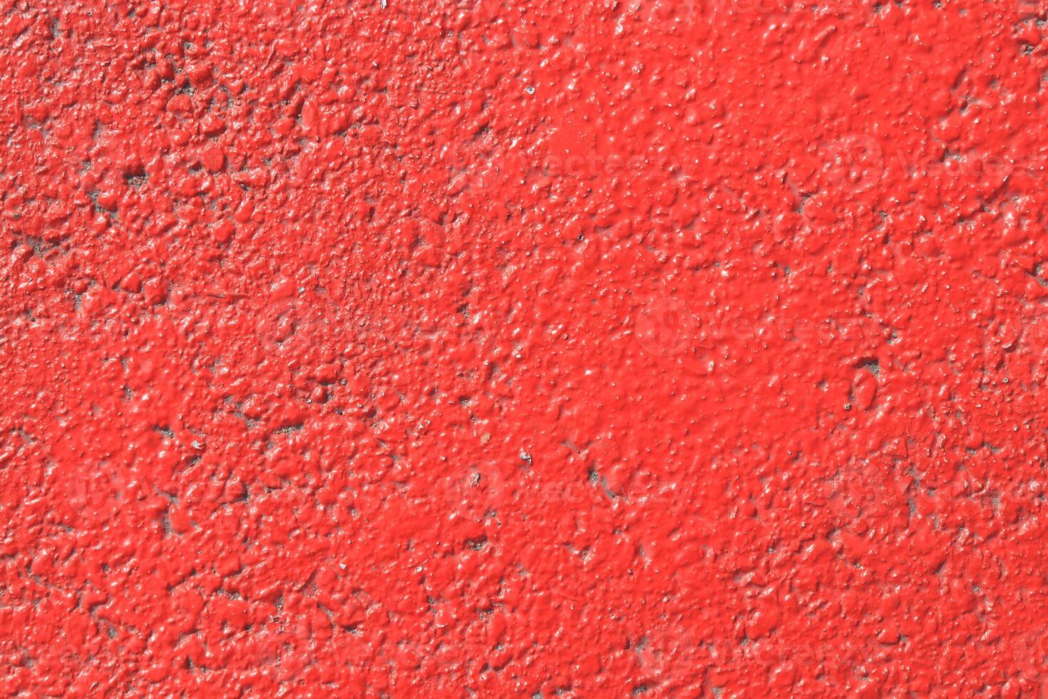Red painted asphalt texture. Colored road surface background. photo