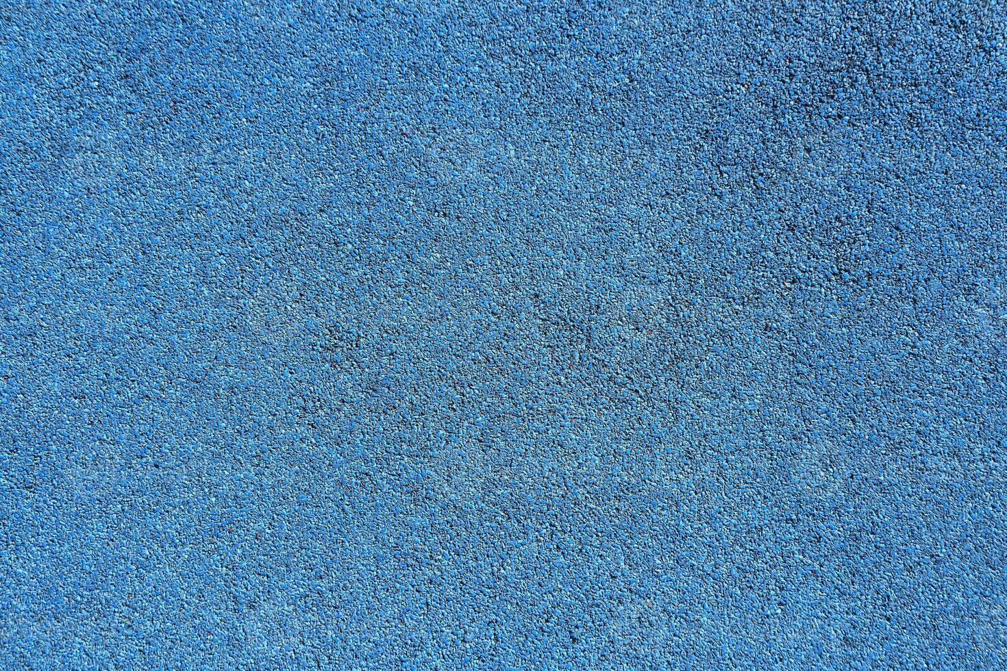 Rubber floor texture. Granules playground cover background. photo