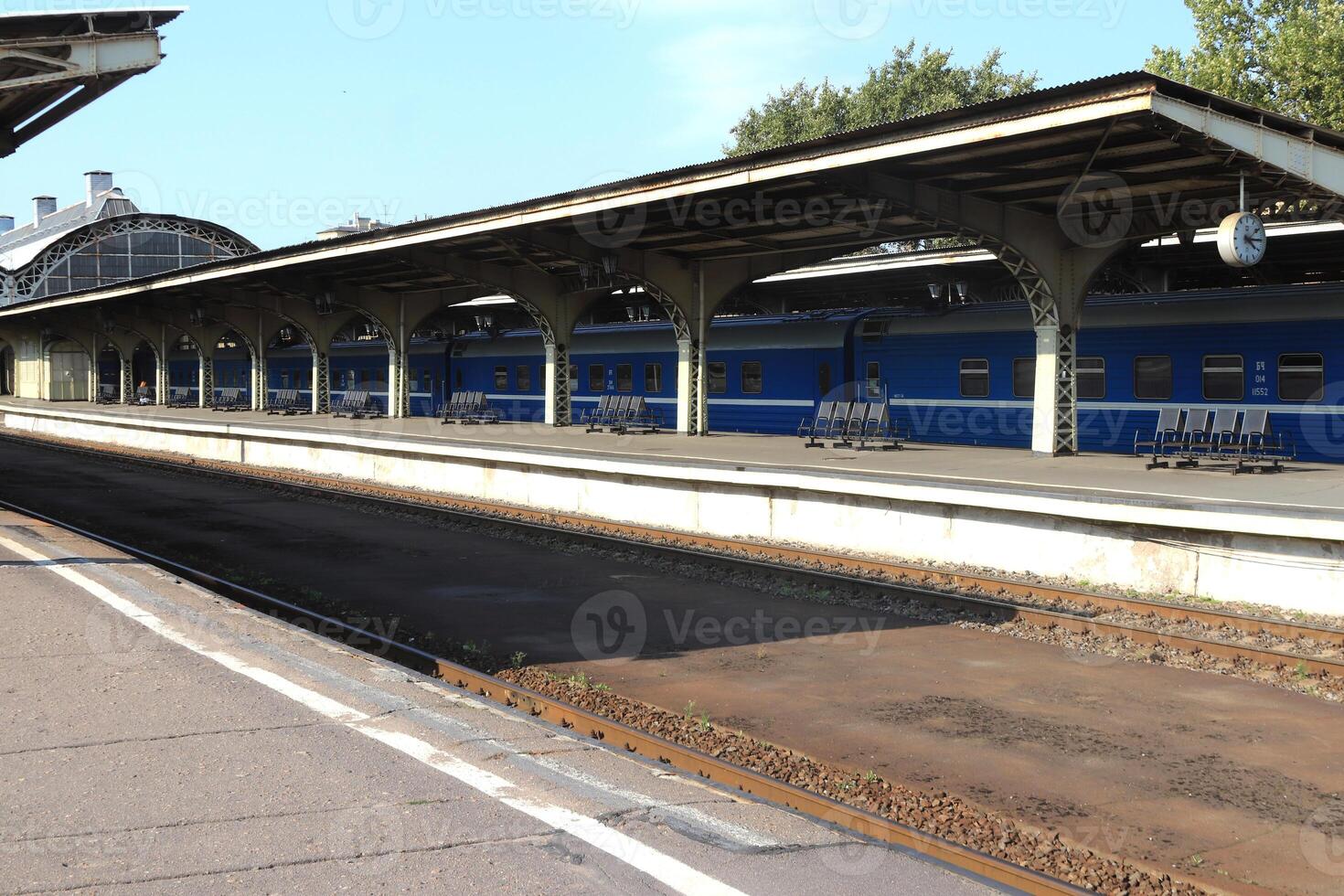Railway station platform with iron canopy construction. photo