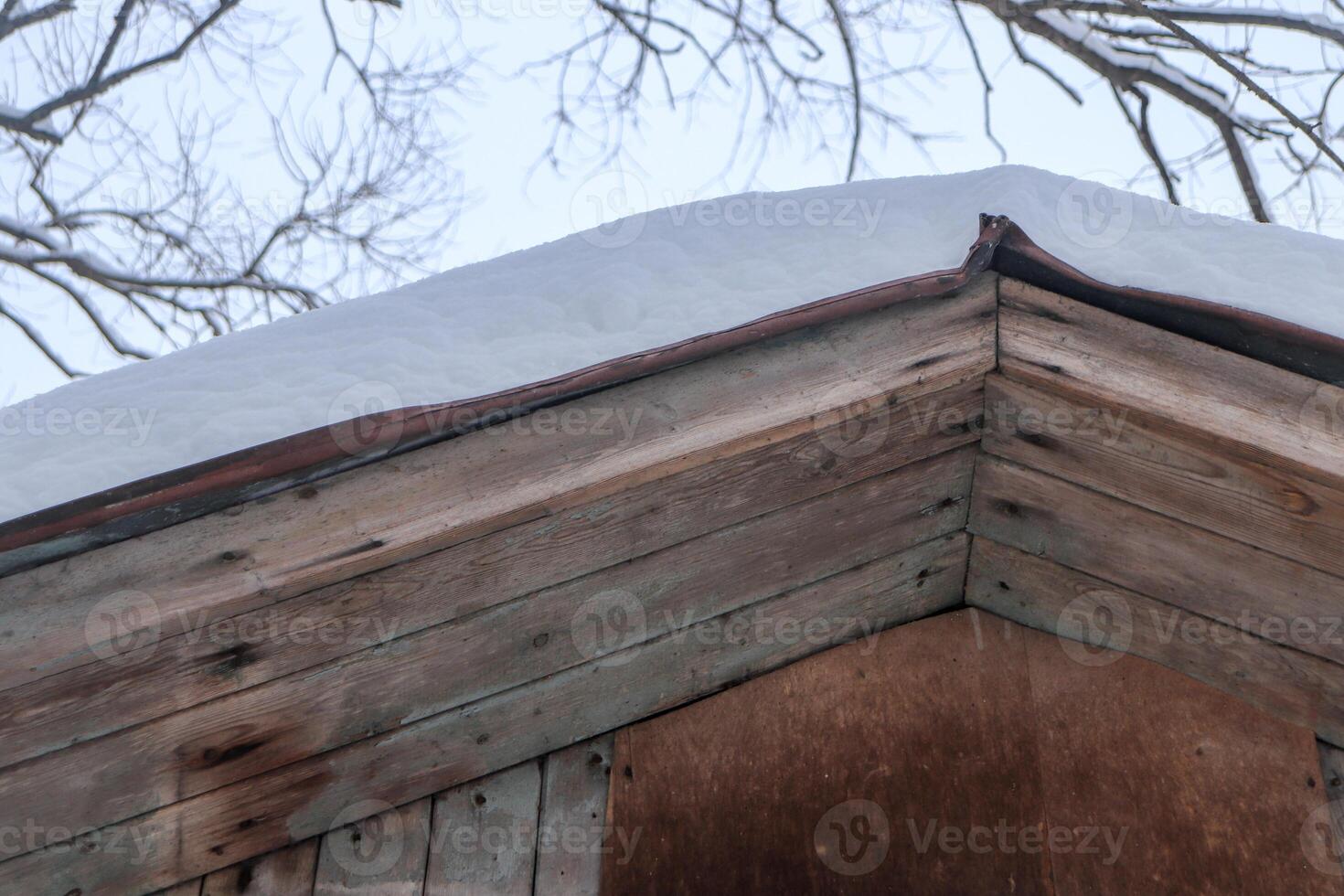 House roof top under snow photo