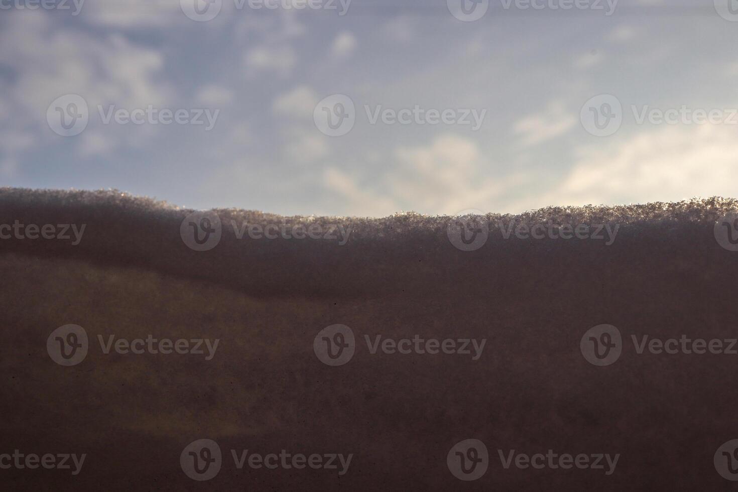 Snow drift with sunlight. Macro closeup. photo