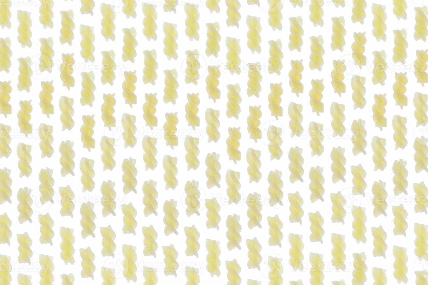 A lot of cooked spiral pasta pattern. Macaroni diet texture. Healthy food culture background. Landscape orientation. Vertical direction. photo
