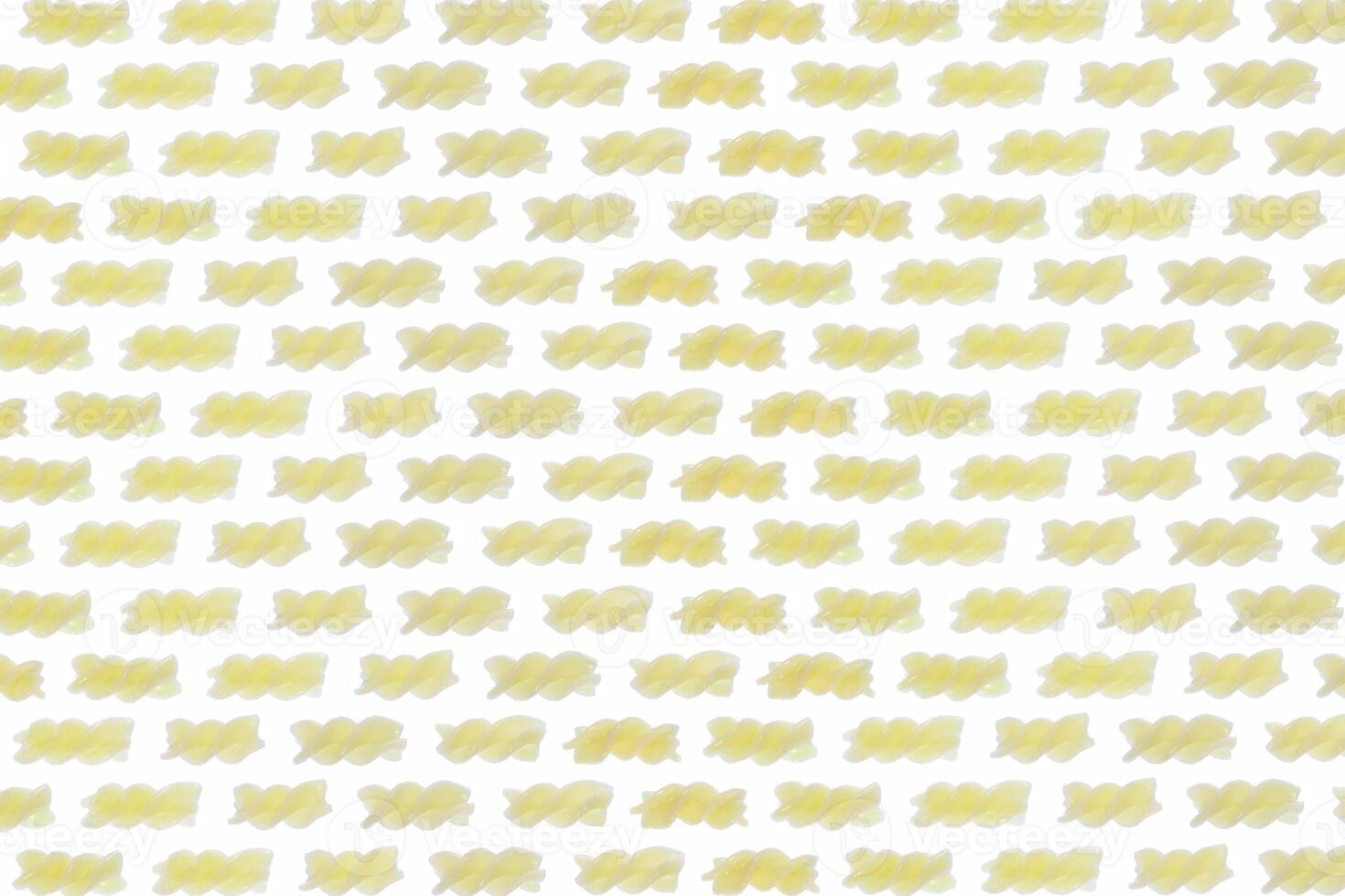A lot of cooked spiral pasta pattern. Macaroni diet texture. Healthy food culture background. Landscape orientation. Horizontal direction. photo