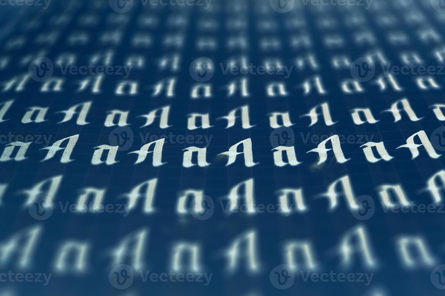 Calligraphic white on dark blue letter A learning skills paper page. Calligraphy letters A background. Lettering practice writing worksheet. Handwriting symbol filling pattern. photo
