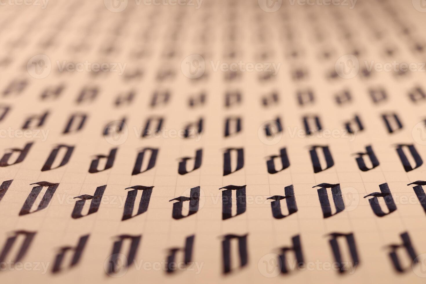 Calligraphic letter D learning skills paper page. Calligraphy letters D background. Lettering practice writing worksheet. Handwriting symbol filling pattern. photo