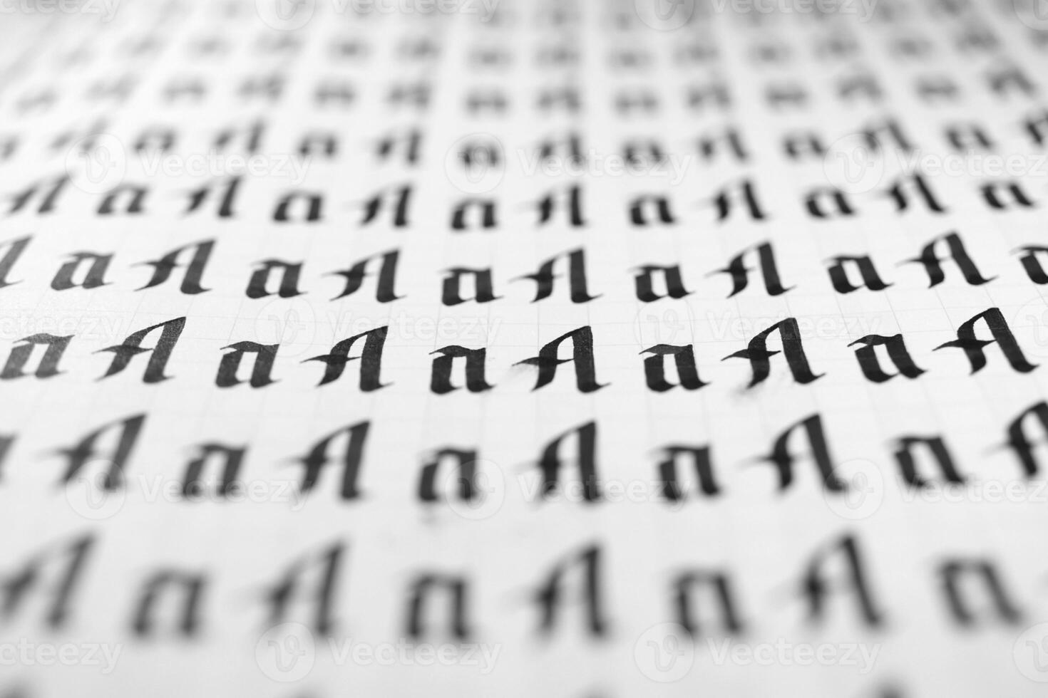 Calligraphy black and white letters A background. Lettering practice writing worksheet. Handwriting symbol filling pattern. Calligraphic letter A learning skills paper page. photo