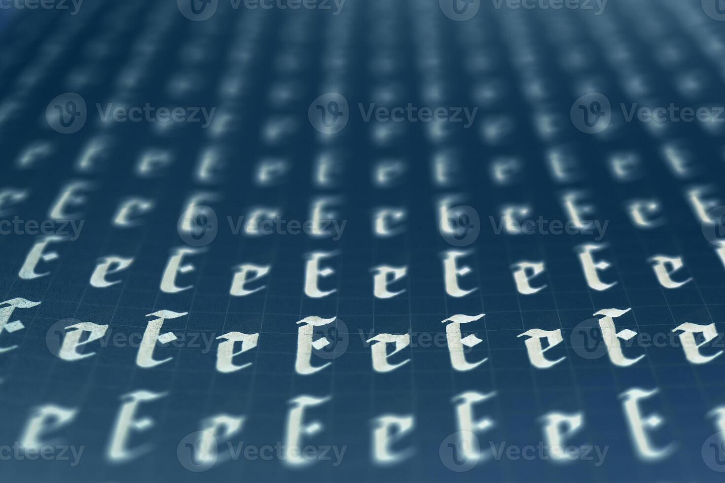 Calligraphic white on dark blue letter E learning skills paper page. Calligraphy letters E background. Lettering practice writing worksheet. Handwriting symbol filling pattern. photo