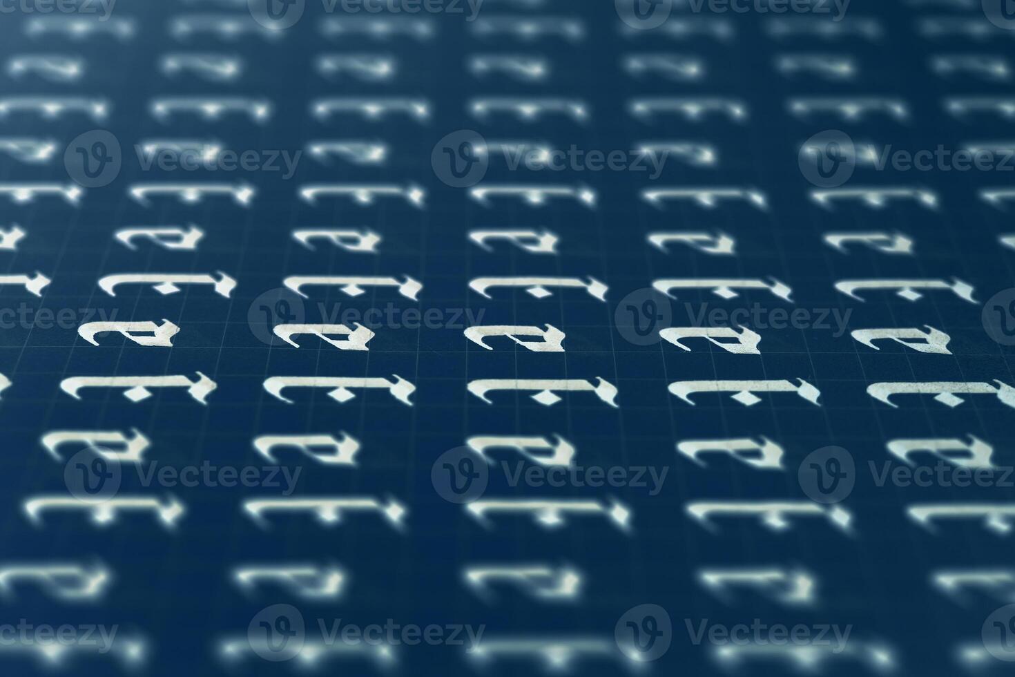 Calligraphic white on dark blue letter E learning skills paper page. Calligraphy letters E background. Lettering practice writing worksheet. Handwriting symbol filling pattern. photo