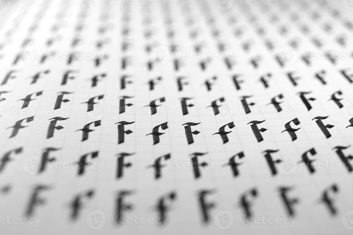 Calligraphy black and white letters F background. Lettering practice writing worksheet. Handwriting symbol filling pattern. Calligraphic letter F learning skills paper page. photo