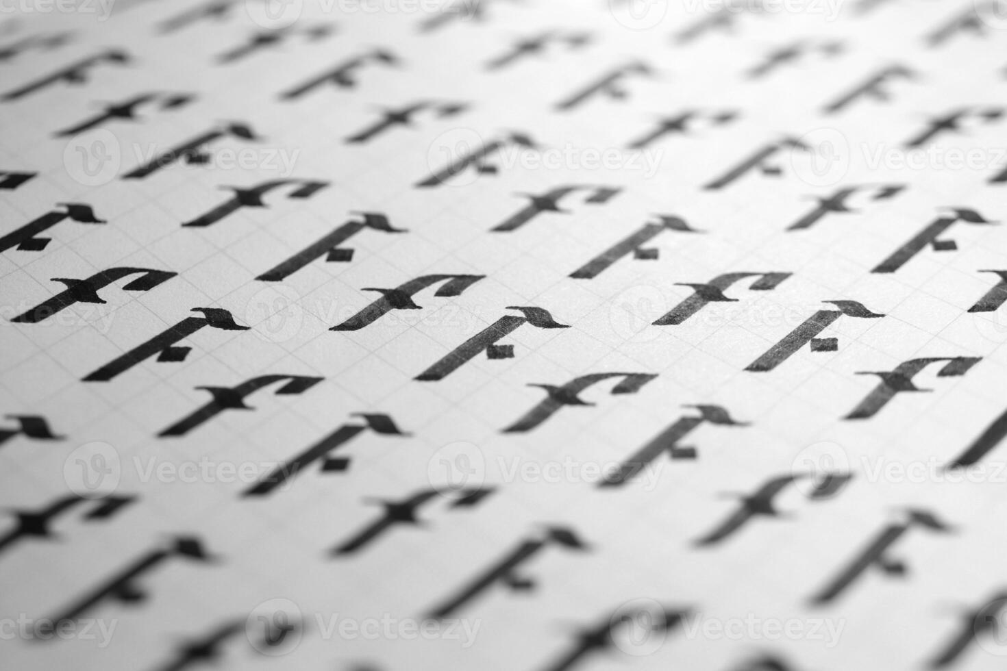 Handwriting black and white symbol filling pattern. Calligraphic letter F learning skills paper page. Calligraphy letters F background. Lettering practice writing worksheet. photo