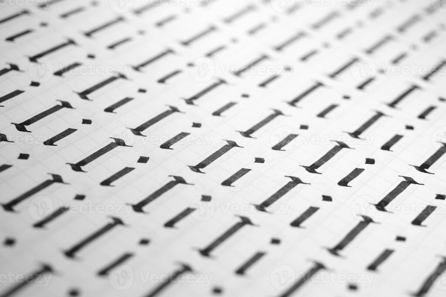 Lettering black and white practice writing worksheet. Handwriting symbol filling pattern. Calligraphic letter I learning skills paper page. Calligraphy letters i background. photo