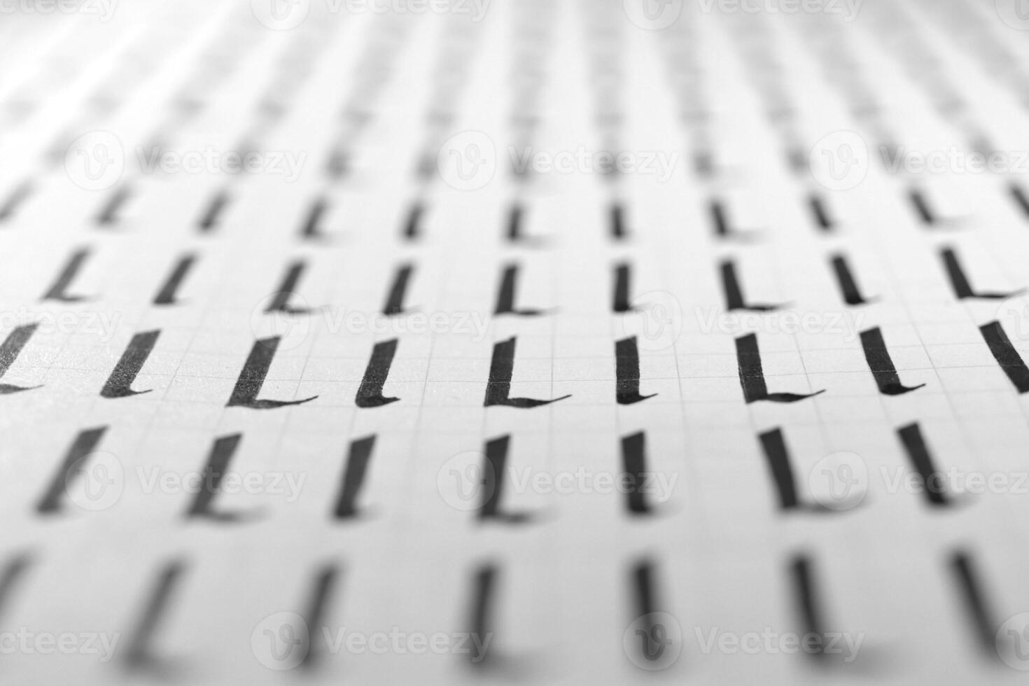 Handwriting black and white symbol filling pattern. Calligraphic letter L learning skills paper page. Calligraphy letters l background. Lettering practice writing worksheet. photo