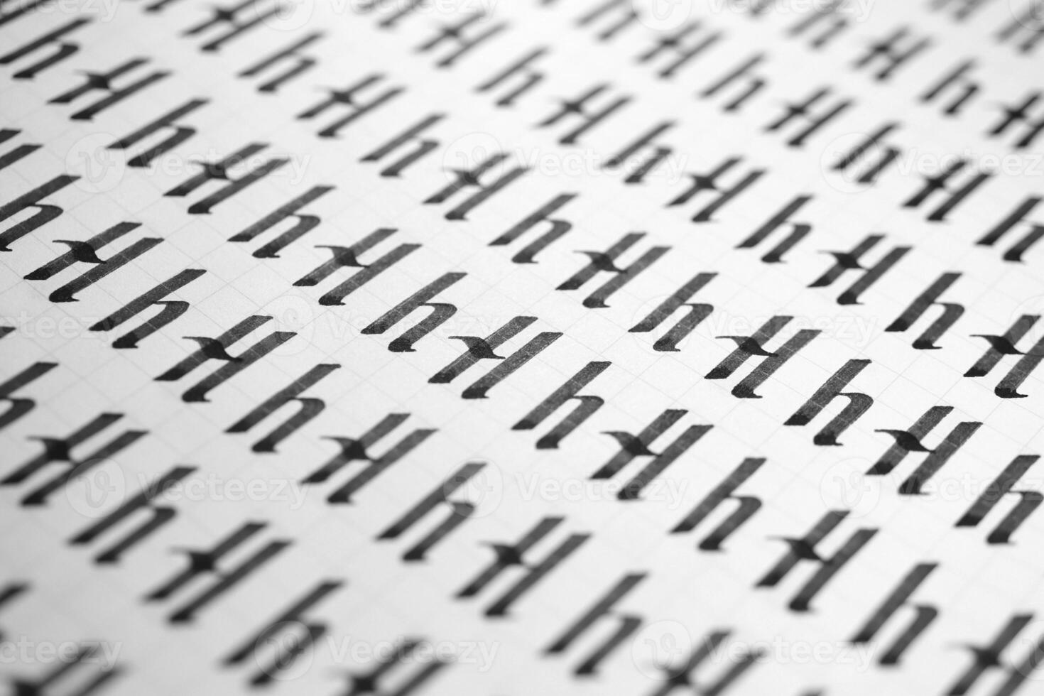 Handwriting black and white symbol filling pattern. Calligraphic letter H learning skills paper page. Calligraphy letters H background. Lettering practice writing worksheet. photo
