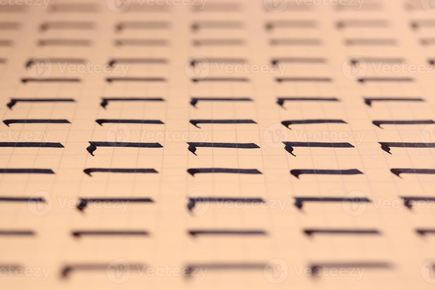 Lettering practice writing worksheet. Handwriting symbol filling pattern. Calligraphic letter L learning skills paper page. Calligraphy letters l background. photo