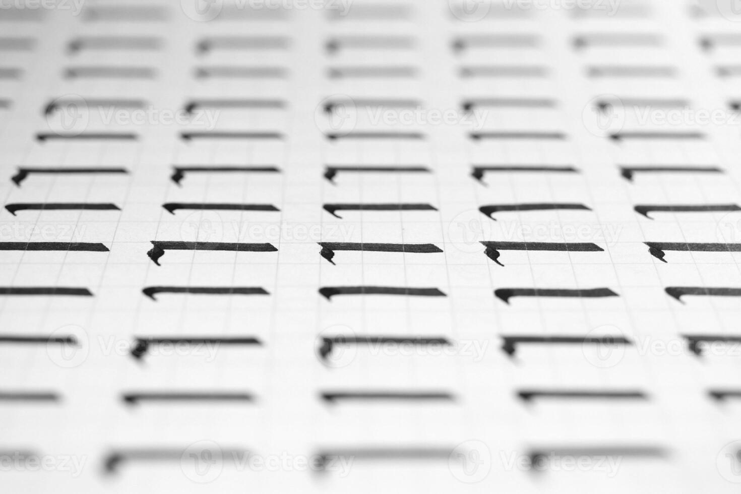Handwriting black and white symbol filling pattern. Calligraphic letter L learning skills paper page. Calligraphy letters l background. Lettering practice writing worksheet. photo