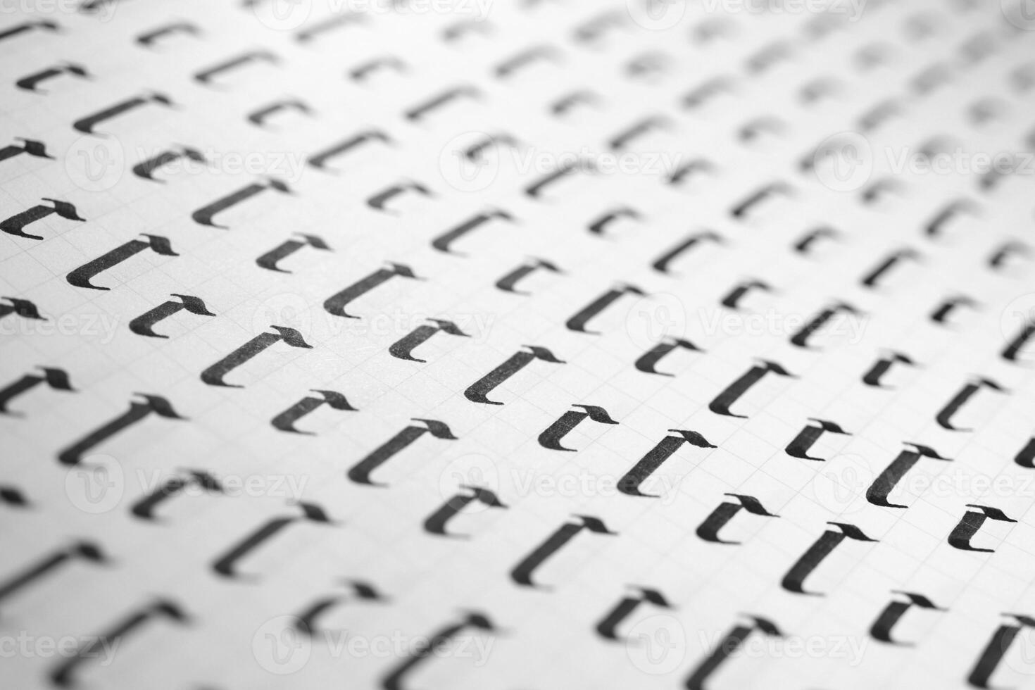 Handwriting black and white symbol filling pattern. Calligraphic letter C learning skills paper page. Calligraphy letters C background. Lettering practice writing worksheet. photo