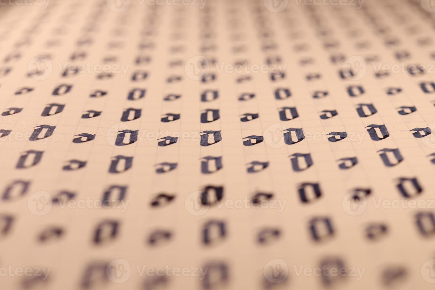 Lettering practice writing worksheet. Handwriting symbol filling pattern. Calligraphic letter O learning skills paper page. Calligraphy letters o background. photo