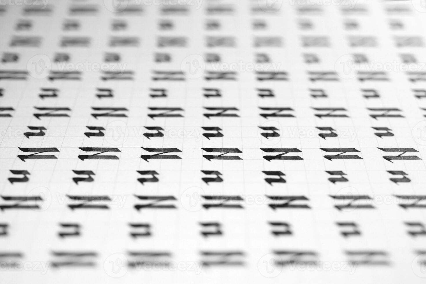 Handwriting black and white symbol filling pattern. Calligraphic letter N learning skills paper page. Calligraphy letters n background. Lettering practice writing worksheet. photo