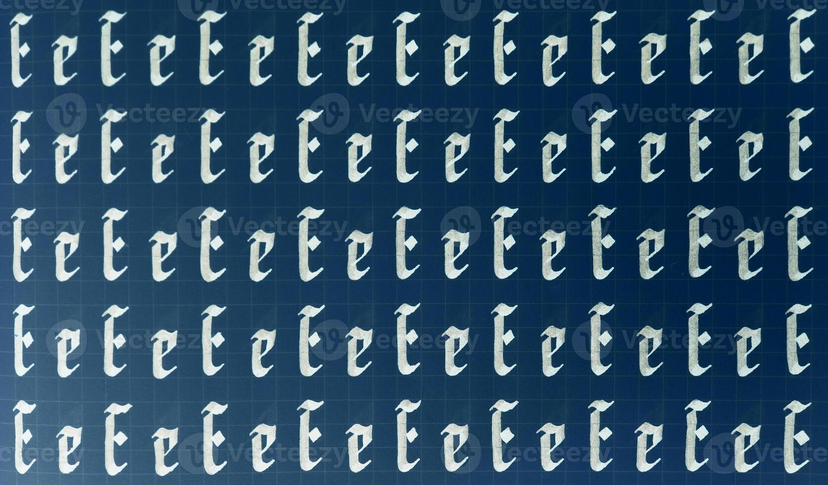 Calligraphic white on dark blue letter E learning skills paper page. Calligraphy letters e background. Lettering practice writing worksheet. Handwriting symbol filling pattern. photo
