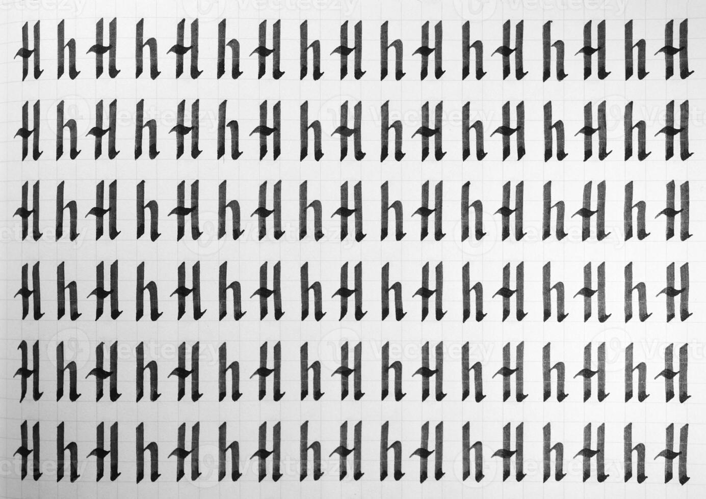 Handwriting black and white symbol filling pattern. Calligraphic letter H learning skills paper page. Calligraphy letters h background. Lettering practice writing worksheet. photo
