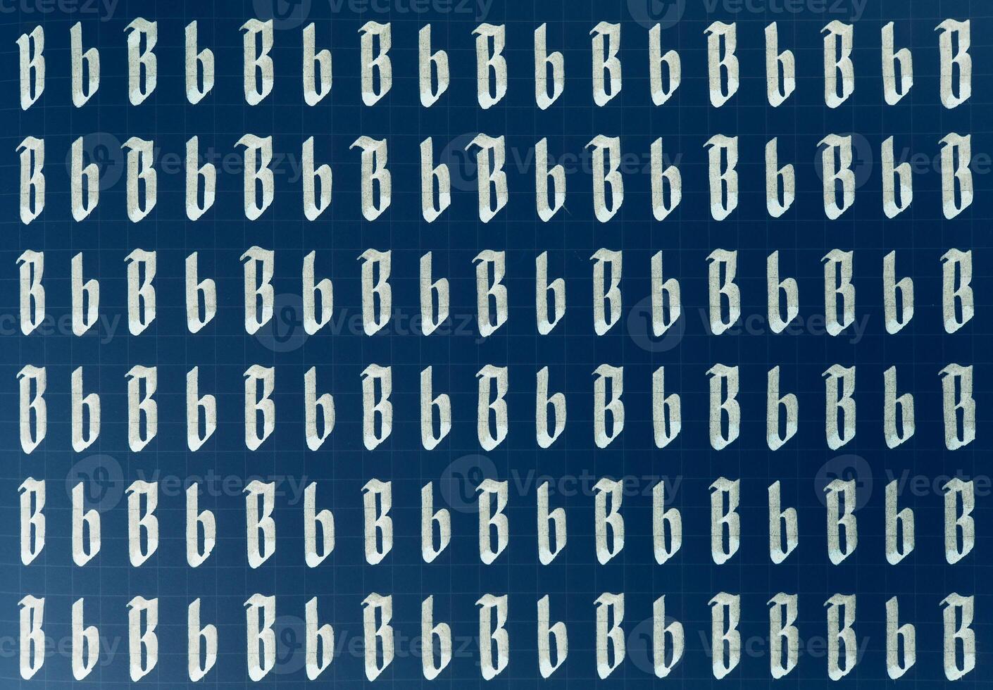 Lettering white on dark blue practice writing worksheet. Handwriting symbol filling pattern. Calligraphic letter B learning skills paper page. Calligraphy letters b background. photo