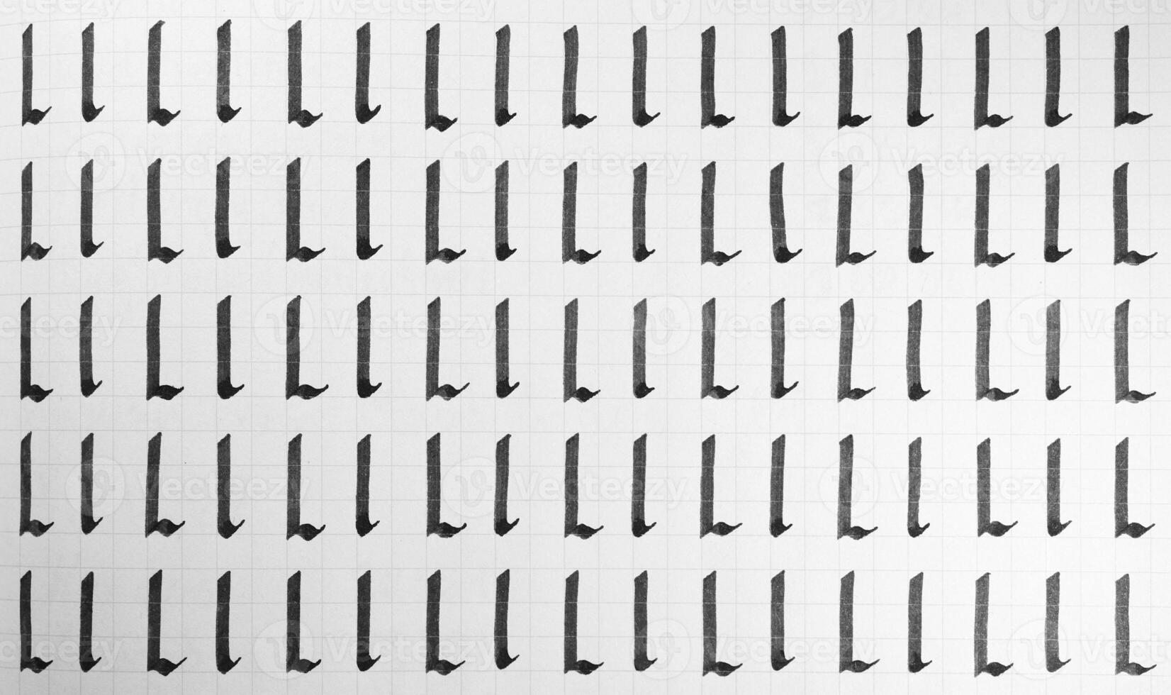 Handwriting black and white symbol filling pattern. Calligraphic letter L learning skills paper page. Calligraphy letters l background. Lettering practice writing worksheet. photo