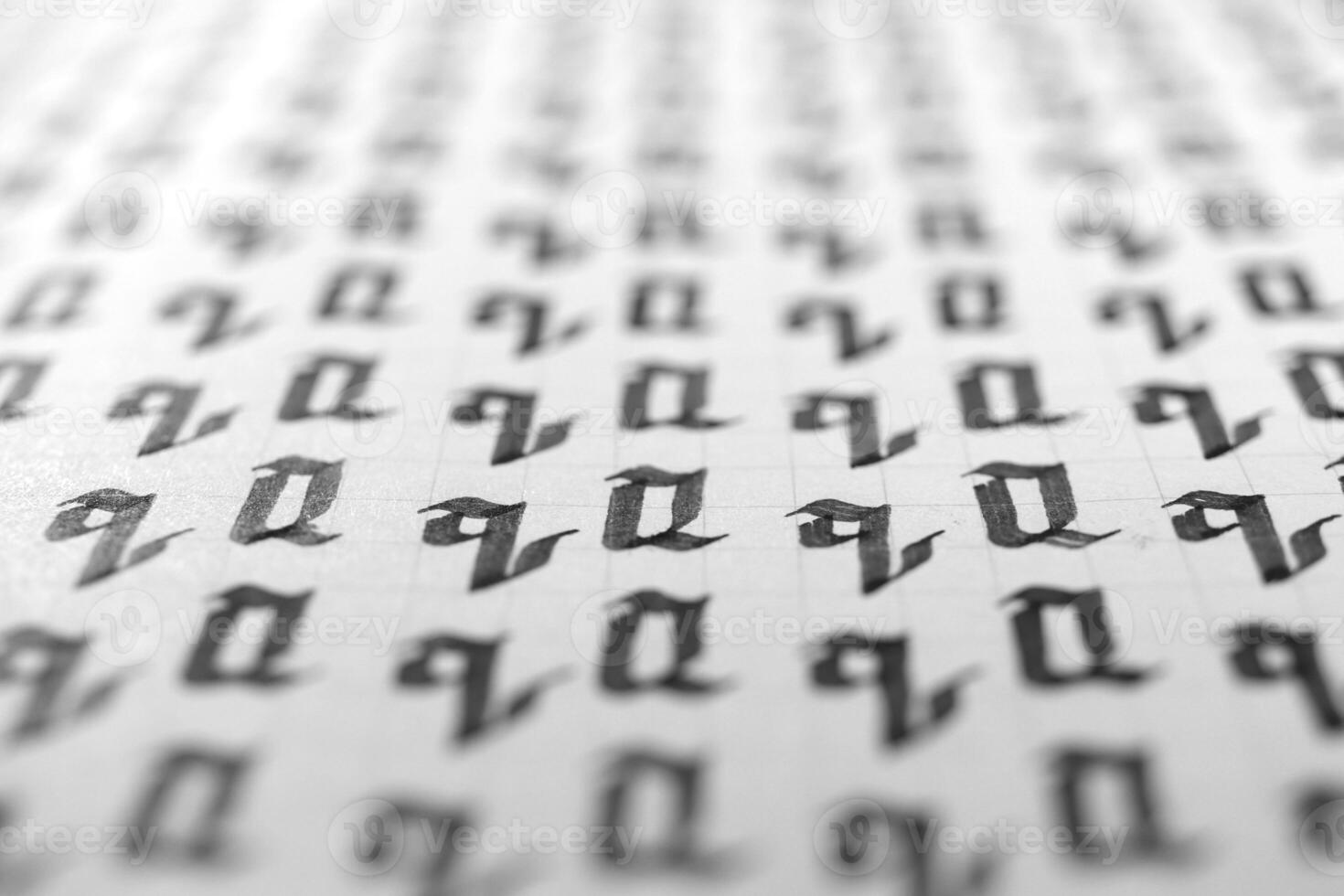 Handwriting black and white symbol filling pattern. Calligraphic letter Q learning skills paper page. Calligraphy letters q background. Lettering practice writing worksheet. photo