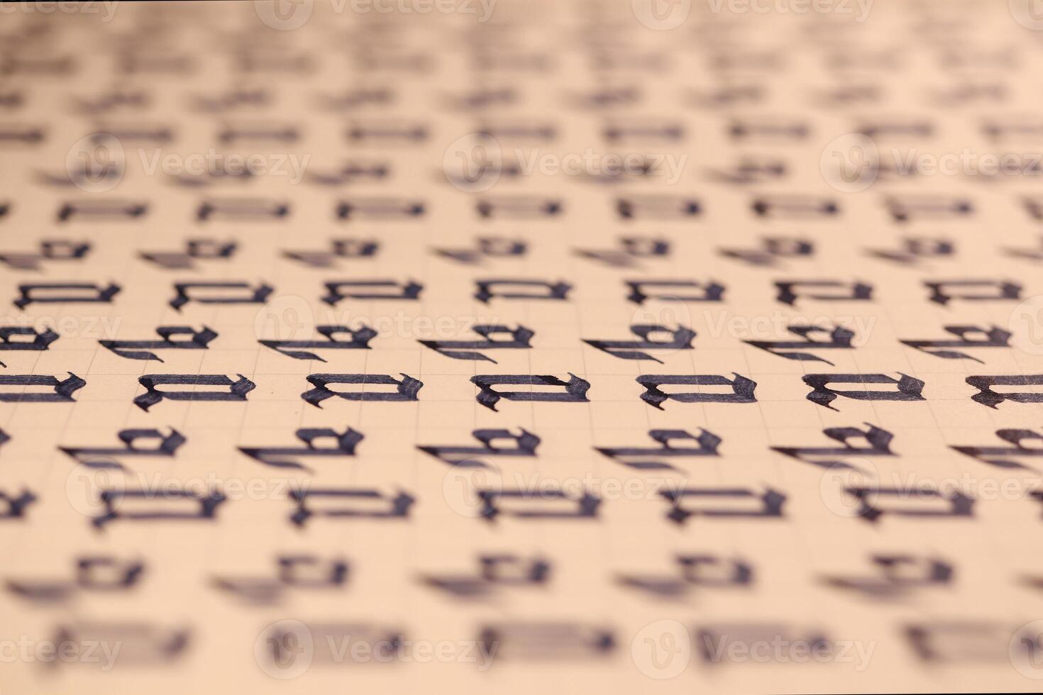 Lettering practice writing worksheet. Handwriting symbol filling pattern. Calligraphic letter Q learning skills paper page. Calligraphy letters q background. photo