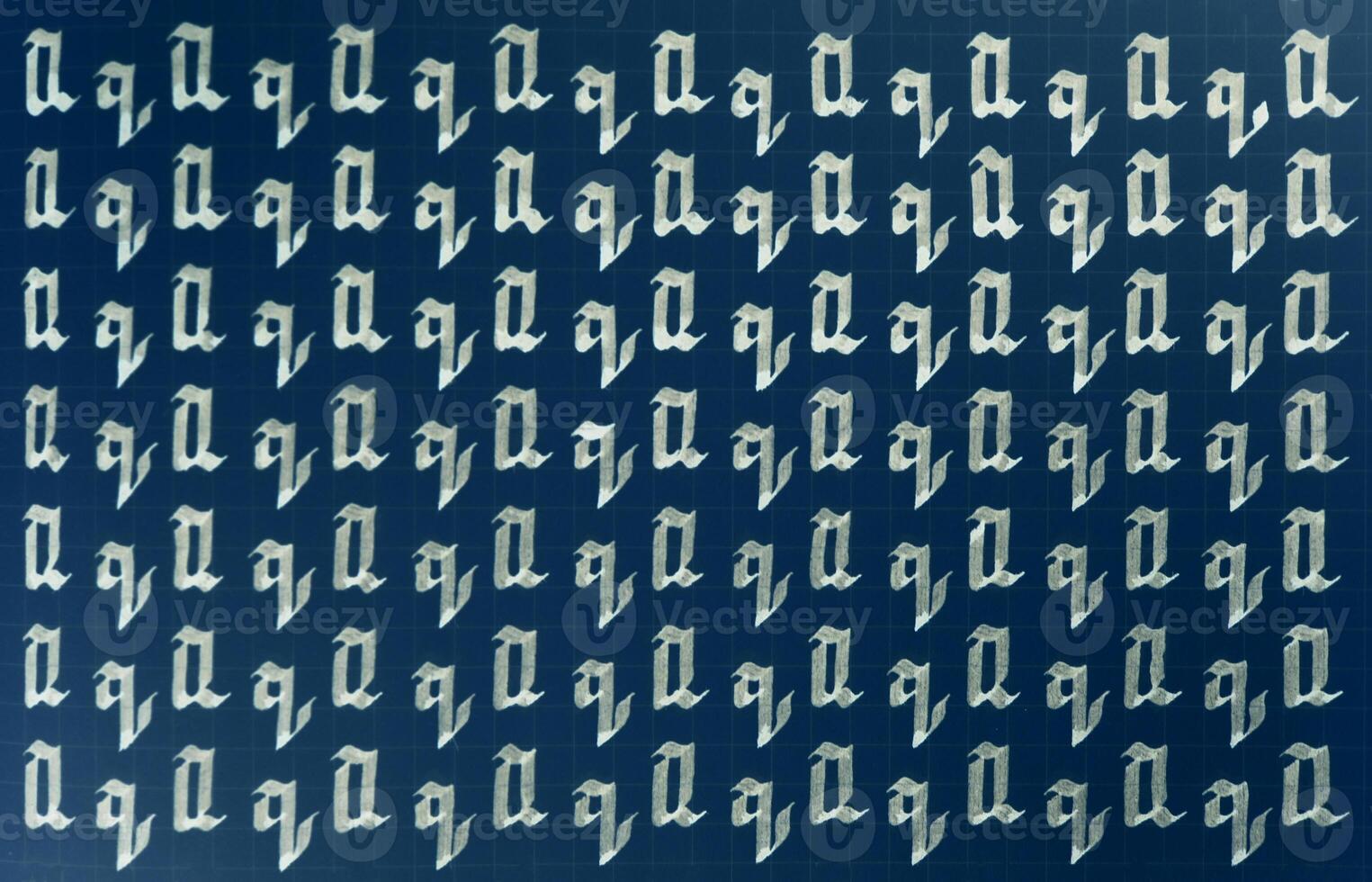 Lettering white on dark blue practice writing worksheet. Handwriting symbol filling pattern. Calligraphic letter Q learning skills paper page. Calligraphy letters q background. photo
