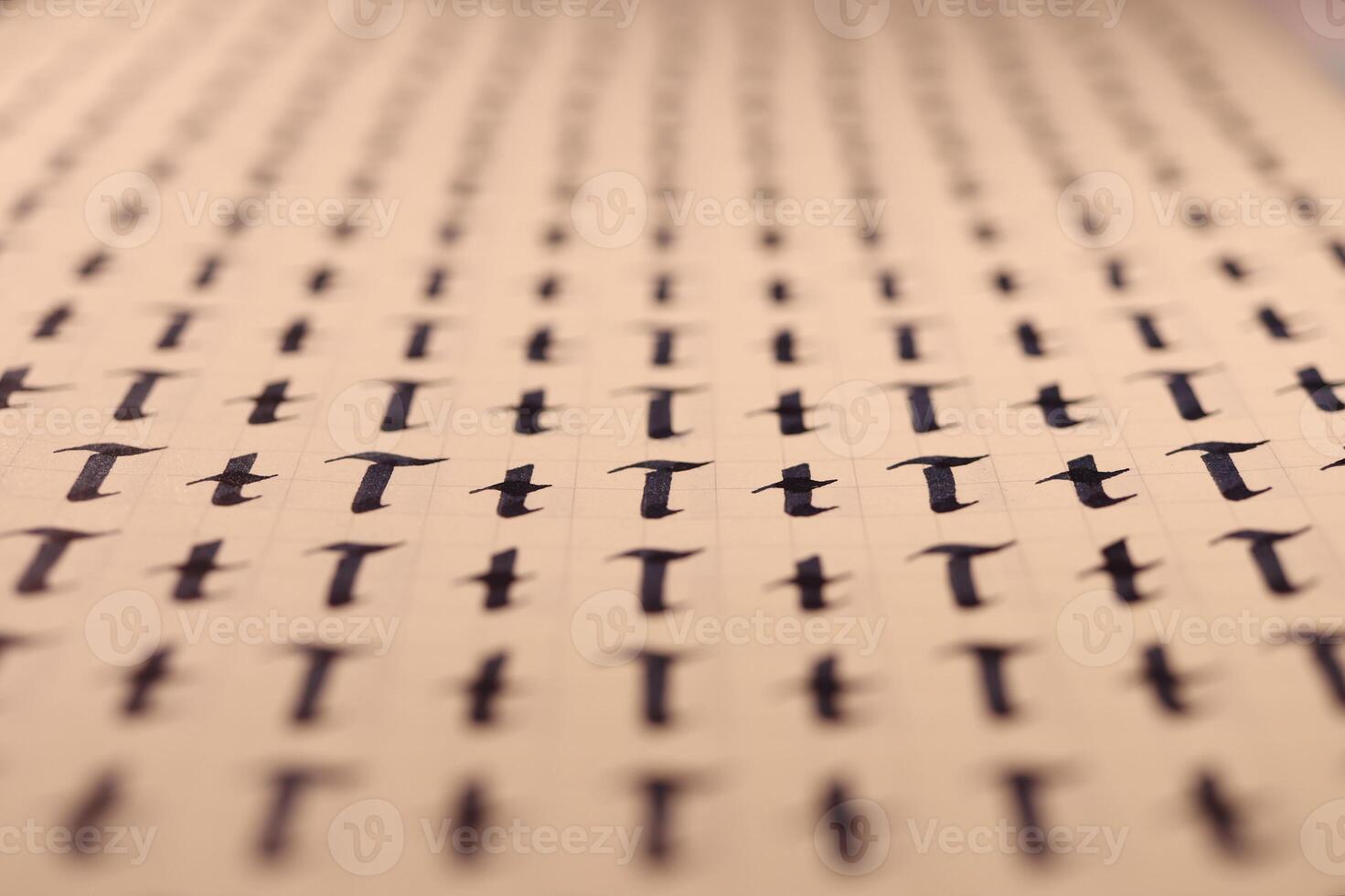 Calligraphic letter T learning skills paper page. Calligraphy letters t background. Lettering practice writing worksheet. Handwriting symbol filling pattern. photo