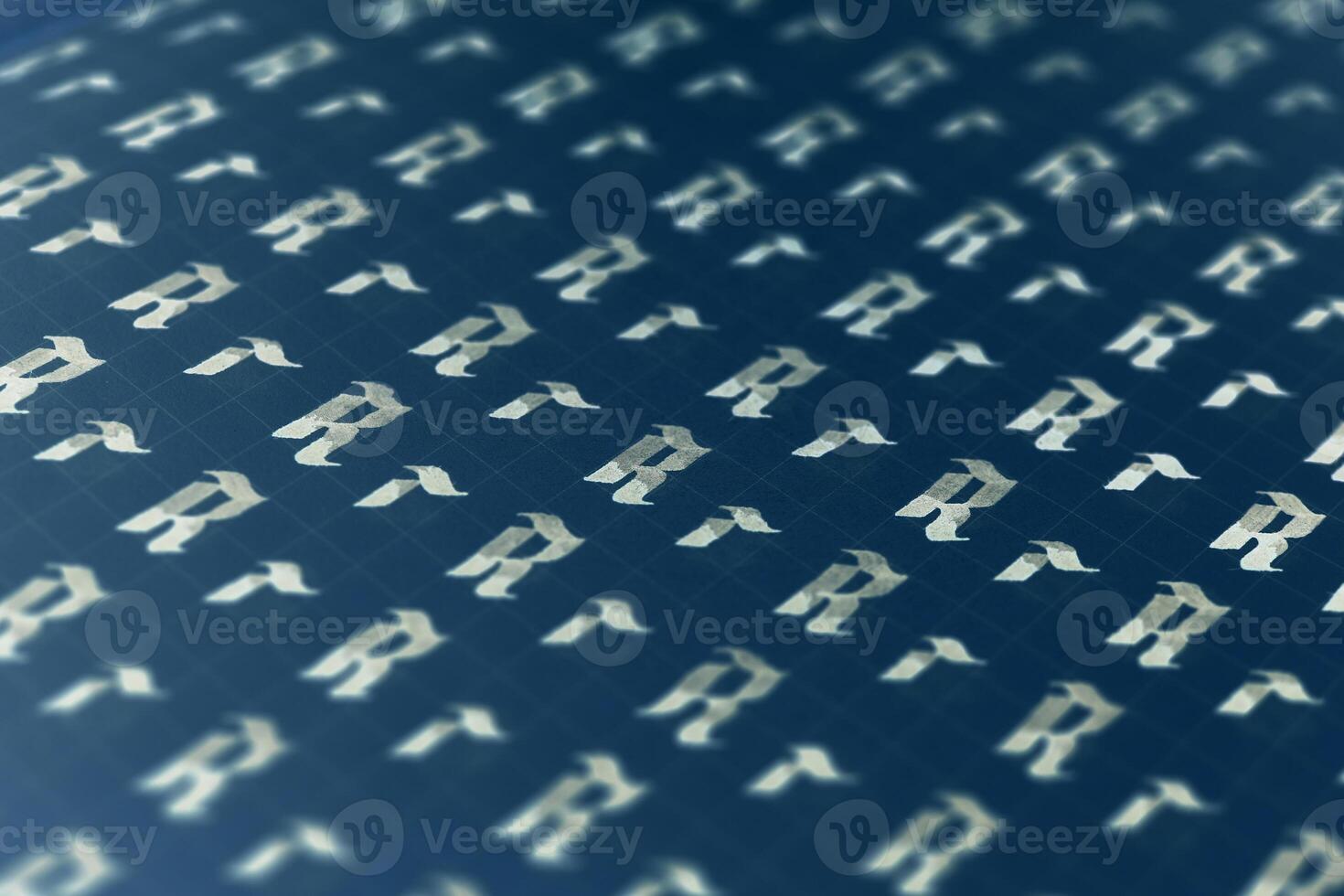 Lettering white on dark blue practice writing worksheet. Handwriting symbol filling pattern. Calligraphic letter R learning skills paper page. Calligraphy letters r background. photo