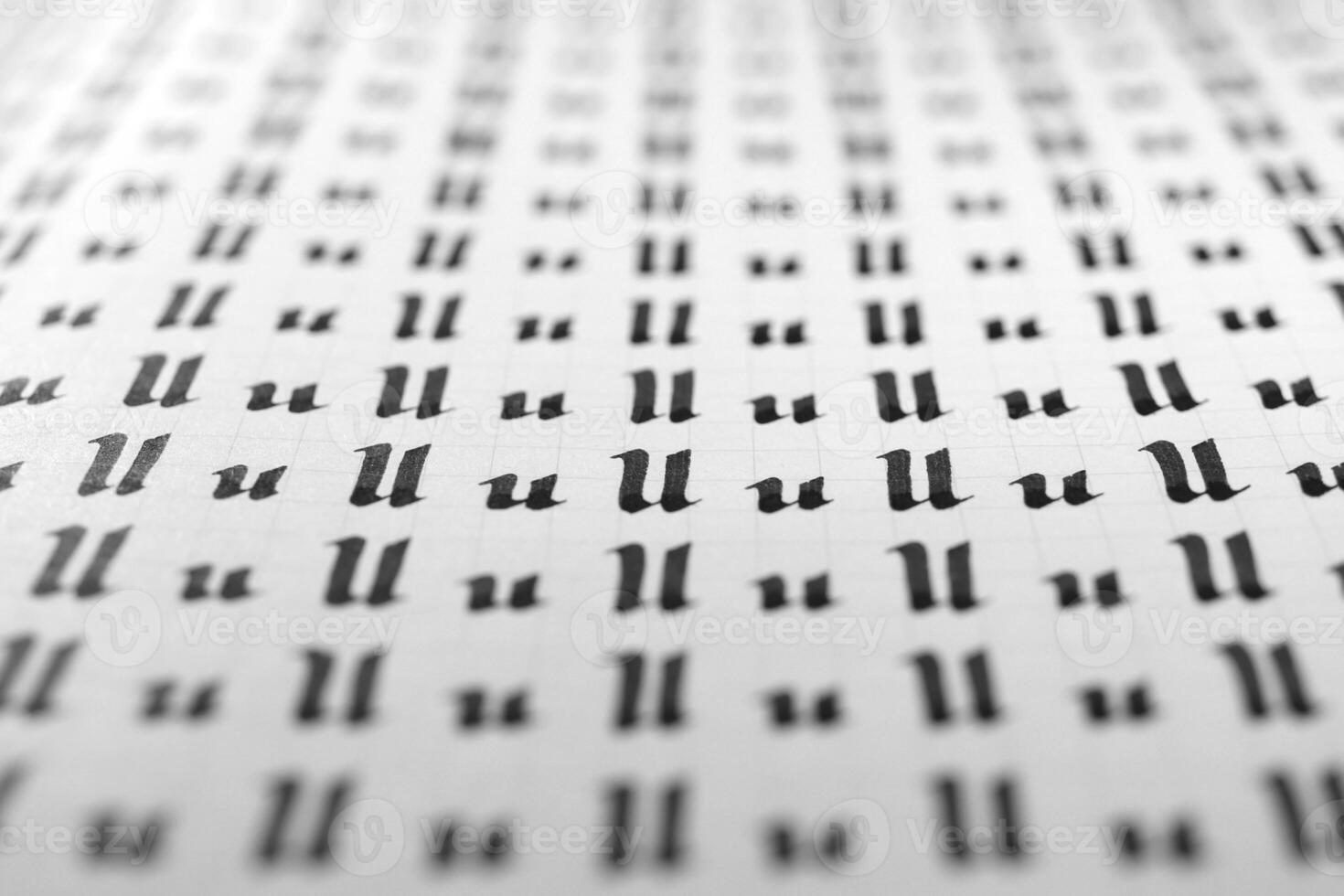 Handwriting black and white symbol filling pattern. Calligraphic letter U learning skills paper page. Calligraphy letters u background. Lettering practice writing worksheet. photo