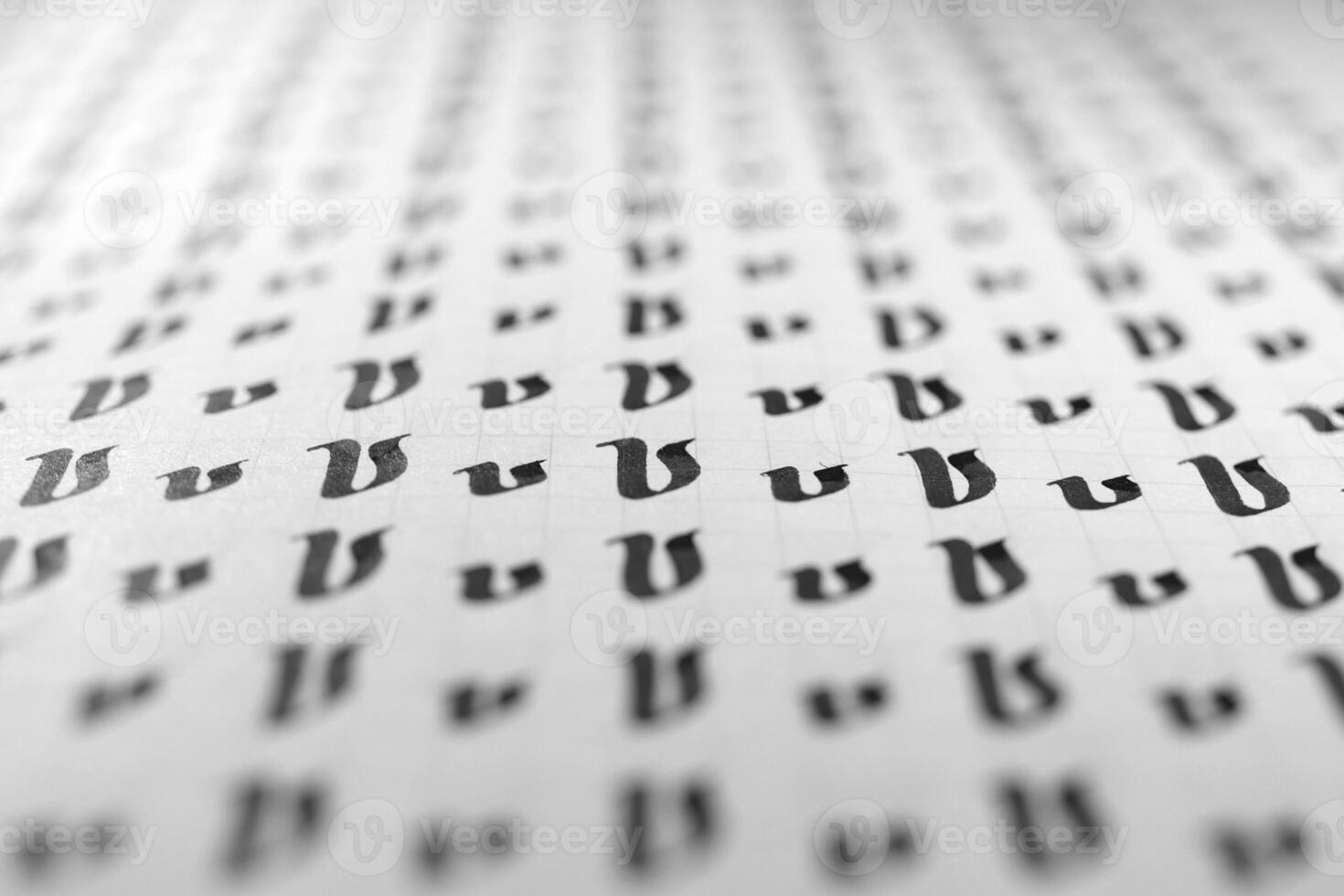 Calligraphy black and white letters V background. Lettering practice writing worksheet. Handwriting symbol filling pattern. Calligraphic letter v learning skills paper page. photo