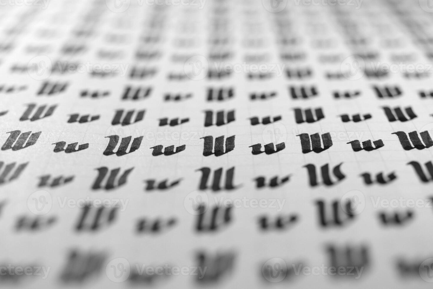 Handwriting black and white symbol filling pattern. Calligraphic letter W learning skills paper page. Calligraphy letters w background. Lettering practice writing worksheet. photo