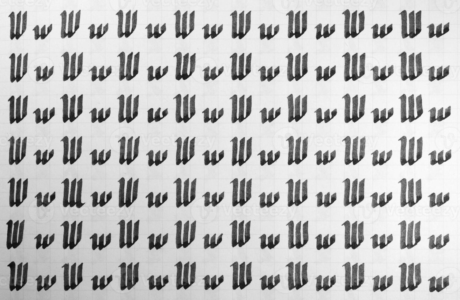 Handwriting black and white symbol filling pattern. Calligraphic letter W learning skills paper page. Calligraphy letters w background. Lettering practice writing worksheet. photo
