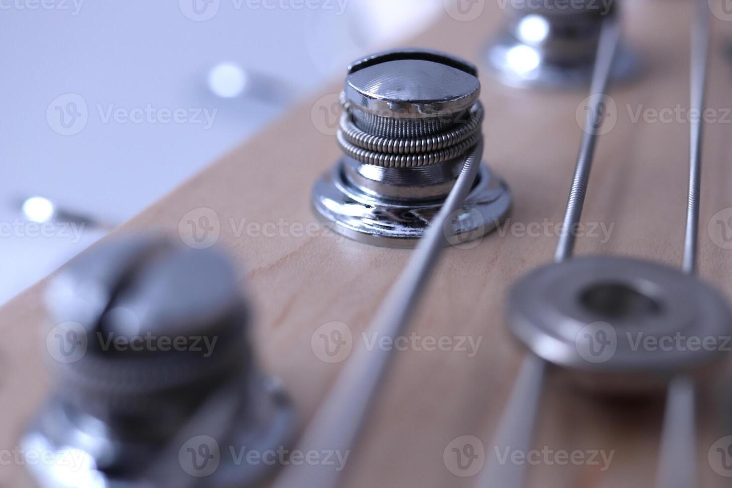 Holding string guitar tuning keys macro closeup. Music instruments background. Musician lifestyle instrument backdrop. photo