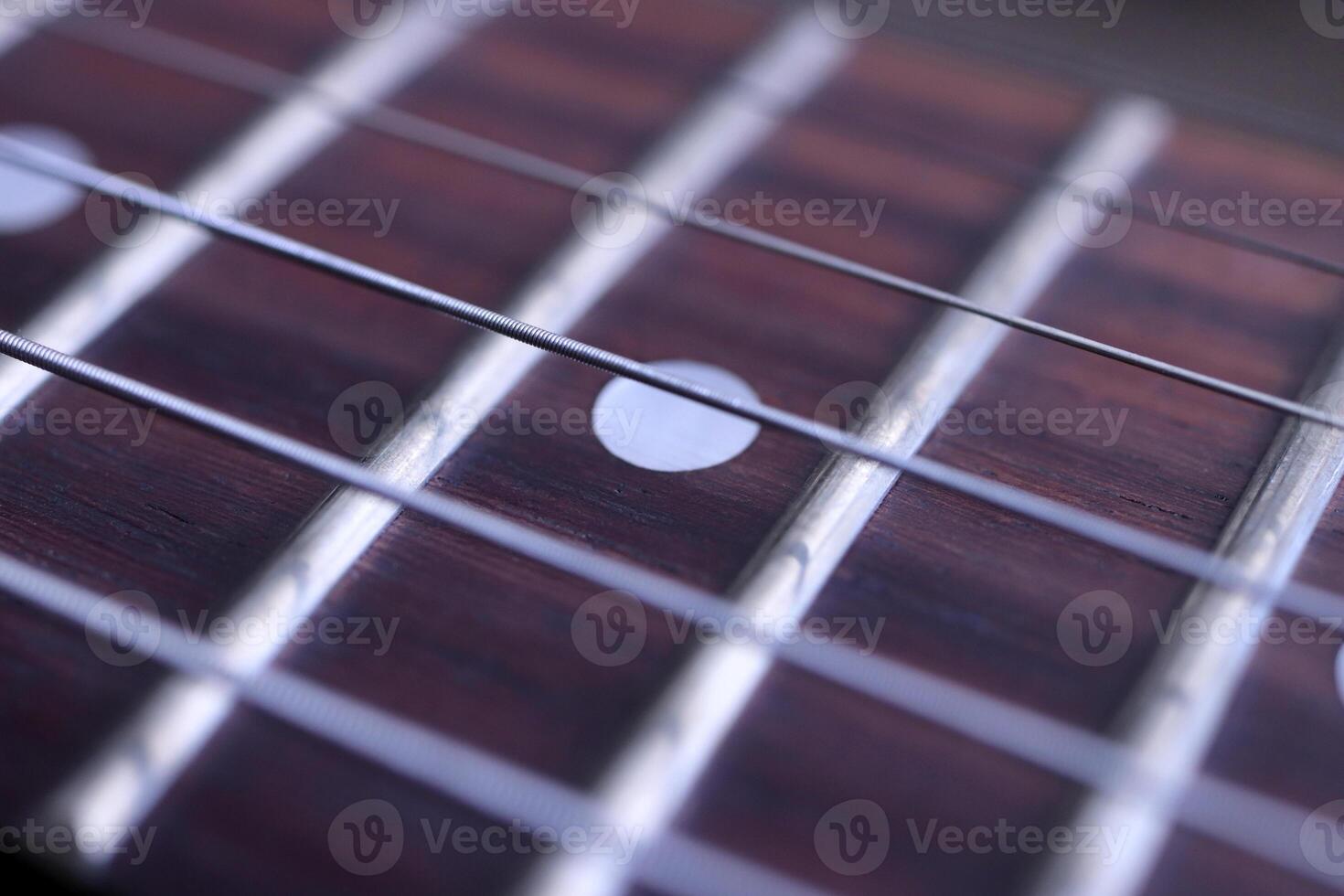 Guitar strings macro closeup. Musician lifestyle instrument backdrop. Music instruments background. photo