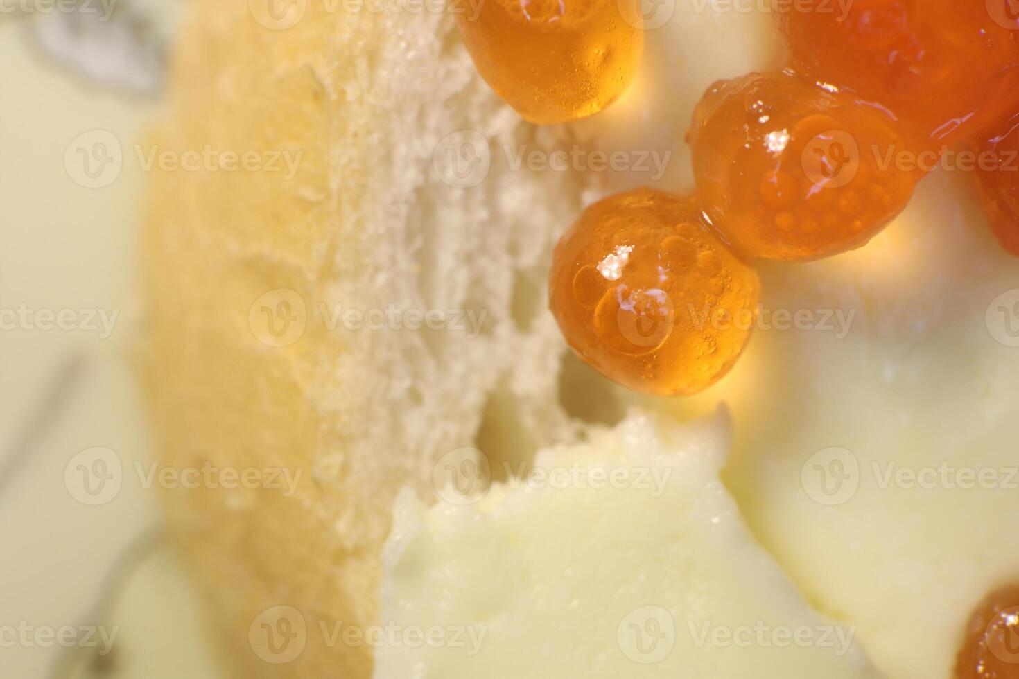 Red caviar on bread and butter. Macro closeup. photo